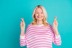 Photo of adorable pensioner woman with blond hairstyle wear striped sweatshirt hold fingers folded isolated on blue royalty free stock images Blue Color Background, Blond Hairstyle, Striped Sweatshirt, Striped Sweatshirts, Color Background