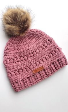 This women's winter hat is hand crocheted using a very soft 100% acrylic yarn in a beautiful rose pink color. The detailed texture of the hat will go well with any kind of outfit, casual or dressed up.  It is long enough and will keep your ears warm while making you look super cute! It also makes a great birthday or Christmas gift for either a teenager or an adult. **Measurements: It has a circumference of 19" and 9 1/4 in height excluding the pom pom.  It should easily fit an average teen or ad Pink Crochet Hat Warm And Cozy, Cozy Pink Crochet Beanie Hat, Cozy Pink Yarn Beanie, Cozy Warm Pink Crochet Hat, Pink Yarn Crochet Hat For Gift, Pink Crochet Hat Made Of Yarn As A Gift, Pink Crochet Hat As A Gift, Pink Crochet Yarn Hat As Gift, Cozy Pink Yarn Hat