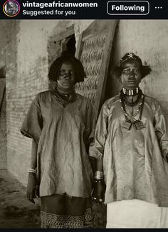 two women standing next to each other in front of a brick wall with the caption, vintage african women suggest for you following