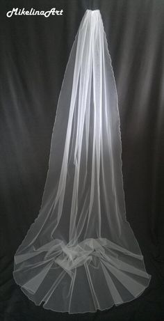 the back of a white veil on a black background