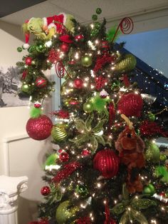 a christmas tree decorated with red and green ornaments