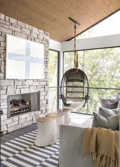 a living room filled with furniture and a fire place