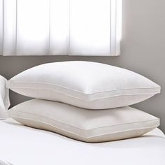 two pillows stacked on top of each other