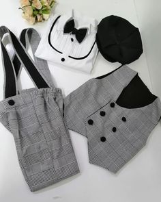 NOTE Please visit my shop for many other kids costumes and custom made outfits.. https://www.etsy.com/shop/SammysCostumes/?etsrc=sdt This  Boys 5 Pieces Slim Fit Black/White or Brown/Beige Plaid Tuxedo is Custom Made to Order. This boys tux comes with Slim Fit Pant, bow tie, cotton embroidered Shirt, Suspenders, Vest and Free embroidered name on arms/cuffs. You can also choose to have date embroidery on one cuff, and name on the other.  This boy checkered wedding suit, ring boy outfit, boys first birthday suit set is perfect for 1st 2nd 3rd up to 8th Year old birthday, wedding ringboy or 3 6 9 12 month photoshoot pictures. Also great for brothers twins matching outfit look and family Photoshoot matching outfit. Complete your look with newspaper boys hat.   FREE SHIPPING and FREE EMBROIDERY Fitted Black Sets For Birthday, Black Fitted Sets For Birthday, Black Cotton Party Sets, Ring Boy Outfits, Newspaper Boy Hat, Plaid Tuxedo, Baby Tuxedo, Toddler Birthday Outfit, Checkered Suit