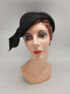 1930s Black Wool Felt Sculptural Style Cloche Brand: Veeda Louisa Measurements: Interior Band Circumference: 20" Height: 2 ~ 3" Condition: Hat is in great vintage condition. Wool felt is in great shape. Some small discoloration around interior hat band and label. See photos for reference. Fitted Vintage Hats For Vintage Fashion, Fitted Retro Hats For Vintage Events, Retro Fitted Hats For Vintage Events, Fitted Vintage Hats, Retro Fitted Formal Hat, Elegant Black Fur Felt Cloche Hat, Black Wool Cloche Hat, Luxury Black Cloche Felt Hat, Vintage Black Wool Hats