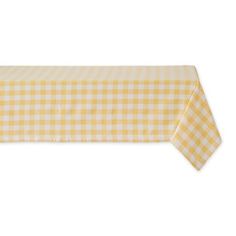 a yellow and white gingham table cloth with a checkered design on it