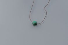 Minimalist necklace in brown silk thread. Square Malachite pendant, very pretty natural semi-precious stone, green, smooth 8 mm 14 k gold filled spring clasp, also Length: 40 cm The gold-filled finish in 14 carat gold is applied to a brass base, with a weight of gold 50 to 100 times greater than a gold-plated product. Gold-filled jewelry has the appearance of gold jewelry at a much lower cost. Much more resistant than classic gold plating, a gold-filled product will oxidize much less quickly. If Silk Thread Necklace, Thread Necklace, Malachite Pendant, Green Malachite, Brown Silk, Classic Gold, Silk Thread, Minimalist Necklace, Gold Filled Jewelry