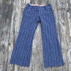 This Pair Of Retro Flares Are A Must Have To Any Wardrobe. Free People Is The Queen Of Flares; They Do It So Well. These Flares Are No Exception. The Navy Striping Adds A Bohemian Character, And The Three Button Waistline Compliments The Stomach. Great For Music Festivals, Or Flower Festivals, Gigs And Photo Shoots. Measurements: Waist: 17” Hips: 22” Rise: 8.5” Inseam: 29” Blue Cropped Leg Pants For Fall, Striped Fitted Cotton Bottoms, Vintage Stretch Blue Pants, Blue Stretch Vintage Pants, Vintage Blue Pants For Spring, Vintage Blue Mid-rise Pants, Vintage Striped Fitted Pants, Vintage Fitted Blue Bottoms, Fitted Vintage Blue Bottoms