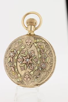 "This 14K tri colored floral and diamond pocket watch is engraved with the initials \"F.H.\". The dial is marked with CHKenkel Cincinati, OH. The movement is signed Seth Thomas.The case measures 54.20mm wide/diameter, and is 20mm tall. C8981GYPPPK --Please reference our policy for more details-- For International orders, please provide a phone number for shipping purposes. Just place a note in the comment box during check out.Thank you.**" Victorian Engraved Watch With Round Dial, Victorian Engraved Watches With Round Dial, Victorian Style Engraved Watch With Round Dial, Antique Engraved Jewelry And Watches For Wedding, Victorian Engraved Round Pocket Watch, Antique Metal Dial Pocket Watch Collectible, Engraved Round Pocket Watch Collectible, Engraved Round Pocket Watch As Collectible, Engraved Collectible Pocket Watch