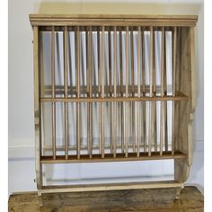 a wooden shelf with metal bars on it