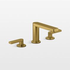 two brass faucets on white background