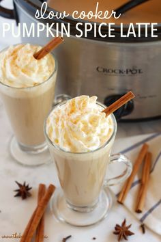 two glasses filled with pumpkin spice latte on top of a table next to an instant pressure cooker