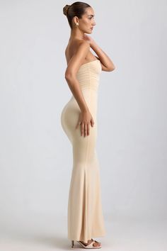 One to save for your next occasion. Perfect for slipping into ahead of sunset drinks or an extra-special dinner date, the Kehlani dress is a statement take on a classic silhouette. It’s made from our signature slinky jersey with a soft-touch feel and falls to a maxi-length fishtail skirt, creating the illusion of a perfect hourglass shape. The strapless bodice is enhanced with considered ruching and anchored with custom-developed hardware that secures the irregular plunging neckline.   Irregular plunge neck  Strapless  Internal silicone taping  Custom-developed metal hardware  Ruched detailing  Low back  Concealed side zip fastening  Bodycon fit  Fishtail hem  Maxi length, approx. 113cm based on a US Size 4  Product code: 8470   We do our best to ensure that our photos are as true to colou Sunset Drinks, Staple Dress, Spring Outfits Dresses, Black Backless Dress, Fishtail Skirt, Hourglass Shape, Kehlani, Special Dinner, Strapless Maxi