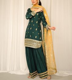 Green raw silk knee length kurti has beautiful lace borders embroidery on top and bottom paired with contrast yellow organza dupatta with lace detailing. This beautiful dress is per for wedding function and mehendi ceremony  ✨If you want any changes in the outfit please contact us. This dress can be customise in any other colour and in all size.We will make this dress as per your choice ✨There may be slight colour difference due to high quality camera resolution and other filters.  🌸Care Instruction Dry clean only Green Slub Silk Straight Kurta Dress, Green Slub Silk Dress With Dupatta, Green Slub Silk Salwar Kameez With Traditional Drape, Green Palazzo Set With Dabka For Eid, Green Slub Silk Kurta With Dabka Work, Traditional Green Palazzo Set With Dabka, Traditional Green Palazzo Set With Dabka Details, Designer Green Palazzo Set With Dabka, Designer Green Dabka Palazzo Set