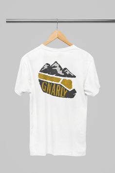 a white t - shirt with the words gnarly on it hanging from a clothes line