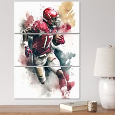 a painting of a football player running with the ball in his hand on a wall