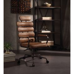 a brown office chair sitting in front of a book shelf with books on top of it