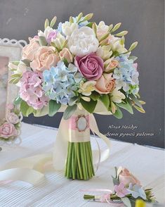 a bouquet of flowers sitting on top of a table