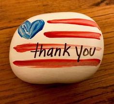 a painted rock with the words thank you written on it