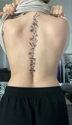 Spine tattoo Cosmos Spine Tattoo, Spine Tattoos On Women, Curvy Spine Tattoo, March Flower Spine Tattoo, Southern Spine Tattoos, Spine Tattoos Sunflower, Floral Spine Tattoo With Quote, Spinal Tattoo Floral, Floral Tattoo Design Spine