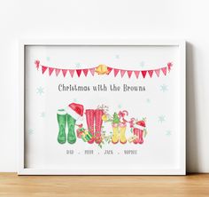 christmas with the browns personalised print in a white frame on a wooden shelf