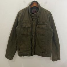 [DESCRIPTION] Please read the description first before buy my items‼️‼️ Vintage Y2k Levis Workwear Jacket (please refer the actual measurements given and compare it with best fitting clothes,by using the size on tag is not always accurate) All in good condition [MATERIAL] Cotton [MEASUREMENT] Measurement:  armpit to armpit : 21 inches  Back collar to bottom : 26.5 inches Sleeve length from under armpit to end of cuff : 19.5 inches [CONDITION] - All in good condition  - Kindly please refer photo Vintage Green Utility Jacket For Streetwear, Levi Denim Jacket Loden Green, Workers Jacket, Vintage Levis Jacket, Levi's Button-up Streetwear Outerwear, Vintage Army Jacket, Thick Jacket, Worker Jacket, Levis Vintage