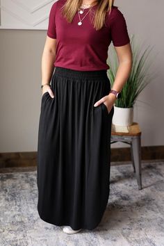 Experience adorable comfort with our Black Smocked Waist Maxi Skirt! This cute and versatile skirt features a smocked waistband for a flattering fit and side slits for added style. Perfect for winter beach vacations or hot summer days, this skirt will keep you looking and feeling great all day long. The Fit of This Boutique Casual Maxi Skirt: Pictured of a typical Medium bottom wearing the Small. Flat Across Measurements in Inches Size: Waist Across Hips Across Length Small 13.5 37.5 Medium 14.5 Long Maxi Skirt Outfits, Choir Outfits, Summer Skirt Outfits, Church Skirts, Skirt Classy, Thrift Board, Casual Maxi Skirt, Casual Mom Style, Skirt Outfits Summer