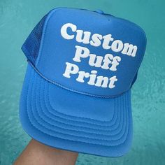 HOW TO ORDER Please check and review the product photos. Choose your hat color. Choose your puff color. Please add your personalization. Click "Add To Cart". You may go back to add as many variations as you would like, or you may simply checkout.  If you have any questions, we are always here to help.  PRODUCT DETAILS Our puff print hats are a perfect blend of style and comfort! Hand crafted with care, these hats have a 100% polyester front and mesh back, giving you that classic yet breathable f Fun Blue Customizable Hat, Customizable One Size Snapback Hat, Novelty Customizable Baseball Cap, Customizable Bucket Hat One Size Fits Most, Customizable Bucket Hat, One Size Fits Most, Customizable Bucket Hat One Size, Customizable Blue Snapback Baseball Cap, Customizable One Size Bucket Hat, Personalized Blue Snapback Hat