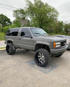 a gray truck parked in a parking lot