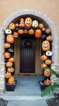 a door decorated with pumpkins for halloween