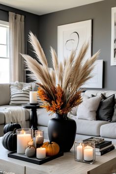 a living room filled with furniture and candles