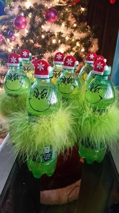 grin - face water bottles in front of a christmas tree