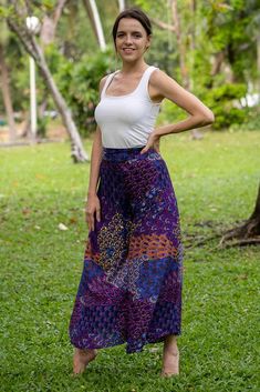 Breezy, comfortable and super easy to combine with your favorite tops.  What's not to love about these Thai Palazzo Pants? The fabric is printed with a mesmerising layered floral pattern which shimmer as the pants move. High-waisted and wide-legged they will suit most figures and are made to be worn as full length pants.  To make these pants more comfortable, elastic has been used on the rear of the waistband, giving you the chance to show off the top of the pants without the smoc Hippie Cotton Bottoms With Floral Print, Multicolor Floral Print Rayon Bottoms, Printed Wide-leg Rayon Bottoms, Bohemian Rayon Pants With Floral Print, Printed Rayon Wide-leg Pants, Printed Rayon Long Pants, Multicolor Floral Print Hippie Bottoms, Bohemian Cotton Pants With Floral Print, Hippie Multicolor Floral Print Bottoms