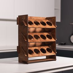 a wooden wine rack sitting on top of a counter