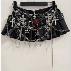 🌟 Edgy and Divine: Chained Cross Mini Skirt 👗 Unleash Your Inner Rebel: Make a bold statement with the Chained Cross Mini Skirt, meticulously crafted for those who dare to challenge conventions and embrace their unique style. This mini skirt is a must-have for anyone looking to add a touch of edgy flair to their wardrobe. ✨ Superior Comfort and Striking Design: Meticulously crafted for top-notch quality, this mini skirt offers exceptional comfort with a striking and daring design. Whether you' Alternative Fashion Accessories, Y2k Clothes Design, Black Concert Top, Alternative Club Outfit, Chains Outfit, Black Fashion Aesthetic, Skirt With Chains, Cross Clothes, Diy Mini Skirt