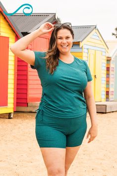 Transform your beach game with our stunning Plus Size Adele Swim Top and Mid-Thigh Swim Shorts. This ensemble offers a tight fit. The swim top has a side ruching for a flattering cinched appearance, short sleeves, and a round neckline. The swim bottom has high-waisted shorts and a wide waistband. Make a splash in style! Follow Calypsa for cute plus-size swimming outfits! Modest Plus Size, Swim Capris, Swimming Outfits, Swim Skort, Plus Swim, Crop Swim Top, Swim Leggings, Athletic Swim, Swim Bra