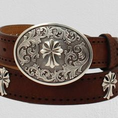 Ariat Ladies Rich Tan Colored Leather Strap Belt This Ladies Ariat Belt By M&F Western Products Is Perfect To Pair With Your Favorite Jeans. It Features A Brown Strap With Perforated Edges And Cross Conchos Down The Center. Its Neutral Colors Will Go With So Much In Your Wardrobe. It Also Comes With A Beautiful Oval Western Etched Buckle With A Center Cross. Ariat Ladies Belt 1-1/2” 48" Tan Rich Tan Colored Leather Strap Perforated Edges Antiqued Silver Color Cross Conchos Floral Detailed Silver Elegant Silver Leather Belt Buckles, Classic Concho Belt Buckles, Silver Leather Concho Belt Buckles, Vintage Silver Leather Belt Buckles, Ariat Belts, Ladies Belt, Cowgirl Belts, Turquoise Belt, Pink Belt