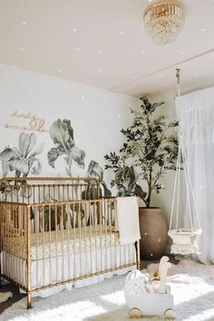 a baby's room decorated in white and gold