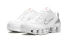 The Women’s Nike Shox TL “White” is the women’s sizing of the retro sneaker in a monochromatic white colorway.  The shoe features a white fabric construction with tonal TPU overlays.  A white patent leather Swoosh logo appears on either side of the shoe.  “Nike Shox” branding is seen on the tongue.  Underfoot, the Shox TL’s signature piston-shaped columns underfoot provide both a comfortable and responsive ride, as well as vintage, Y2K-era flair. Nike Shox Tl White, Womens White Shoes, Nike Air Zoom Spiridon, Nike Shox Tl, Nike Shox Shoes, Tenis Nike, Exclusive Sneakers, White Shoes Women, Nike Shox