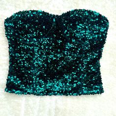 Elevate Your Wardrobe With This Stunning Zara Sequin Bandeau Top. The Top Is Crafted With 100% Polyester Material And Features A Beautiful Green Color With Silver Sequin Accents, Making It Perfect For Any Formal Occasion. The Sleeveless And Strapless Design Is Complemented By An Illusion Neckline, Adding A Touch Of Elegance To The Blouse. The Cropped Style And Regular Fit Make It Perfect To Pair With High-Waisted Pants Or Skirts, While The Limited Edition Features And Metal Theme Will Make You S Fitted Bandeau Tube Top For Prom, Fitted Bandeau Tube Top For A Glamorous Look, Fitted Glamorous Bandeau Tube Top, Glamorous Fitted Bandeau Tube Top, Zara Fitted Party Crop Top, Zara Sleeveless Corset For Parties, Zara Fitted Crop Top For Party, Summer Party Corset With Sequins, Strapless Fitted Crop Top For Party Season