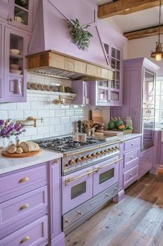 a kitchen with purple cabinets and white counter tops is pictured in this image from the front view