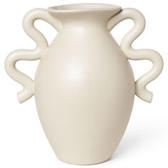 a white ceramic vase with curved handles