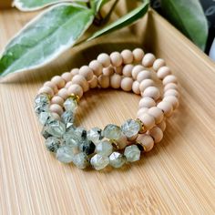 "This bracelet is made with natural prehnite and wooden beads. Sold as a single bracelet. Essential Oil NOT Included. Aromatherapy on the Go: Add a drop (or more) of your favorite essential oil to the natural wood beads and rub it in to diffuse for the day. Scent typically lasts a day or two depending on the oil you use. Prehnite is considered a \"stone of dreaming\"; it is believed to increase the power of the dream state, strengthen lucid dreaming and promote communication with other planes of existence. It is also considered a \"stone of prophecy,\" with long use by indigenous peoples of South Africa. Because of its ability to improve intuition, prehnite stones are considered beneficial for people who work in environments that require a high level of attention to detail. This adjustable Green Natural Stone Beaded Bracelets For Meditation, Earthy Green Bracelets For Meditation, Green Wooden Beaded Bracelets, Nature-inspired Wooden Beads Jewelry For Meditation, Nature-inspired Meditation Bracelets With Natural Stones, Oil Diffuser Bracelet, Essential Oil Diffuser Bracelet, Garden Jewelry, Diffuser Bracelets