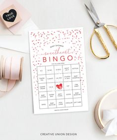 a printable sweetest bingo game on a table with scissors, tape and other items