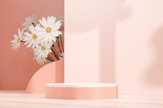 a vase with daisies in it sitting on a table next to a pink wall