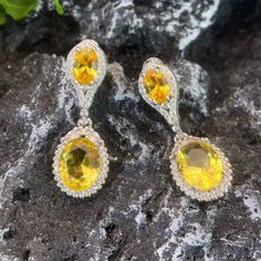 ✰ 2 shiny yellow cz gemstones makes the drop earring with halo more sparkly and graceful  ✰ This delicate lab-created handmade gemstone dangle earrings is perfect for people who want to achieve a brilliant and splendid look ✰ This yellow earrings dangle not only suitable for formal occasions such as banquets, weddings, theme parties, but also for everyday wear ✰ This dangle earrings wedding is a very special gift for birthday, Mother's Day, Valentine's Day and more  ✰ Comes with an exquisite gift box We also offer the ring and necklace from the same collection: https://www.etsy.com/listing/1236503255/yellow-zircon-ring-with-halo-yellow-oval https://www.etsy.com/listing/1220589212/oval-zirconia-necklace-perfect-birthday Materials: Environmentally-friendly copper Needle Materials: Silver Qua Earring Bridal, Dangle Earrings Wedding, Zirconia Necklace, Earring Silver, Cubic Zirconia Jewelry, Theme Parties, Yellow Earrings, Zircon Ring, Earrings Wedding