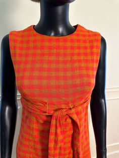 Vintage 1960s Autumn Gingham - Orange - Rust - Fall Sleeveless Dress in Raw Linen - Fabric Belt - Micro Mini Length -  Very Biba Design -   A perfect dress for a fall event or autumnal gathering.  Very flattering and minimalist mod design signature of the era. Size: U.S. Small Measurements: Bust: 34 inches (up to 35 taut) Waist: 27 (up to 28 taut) Shoulders: 14 inches Overall Length: 34 inches Arm Opening: 7.5 inches Condition: EXCELLENT very wearable, strong dturdy fabric and seams. Zipper work Sleeveless Plaid Retro Dress, Vintage Plaid Sleeveless Dress, Vintage Sleeveless Dress For Picnic, Fall Events, Micro Mini, Fabric Belt, Vintage 1960s, Dress Clothes For Women, Linen Fabric