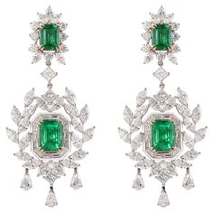 This collection uniquely integrates a geometric Art Deco Style frame with playful tassels from the Mughal era. A sophisticated and classic set made to be passed through generations. Exclusively by Sunita Nahata Fine Design… Art Deco Style Emerald and Diamond Earrings in 18 Karat White and Yellow Gold. Emerald: 1.93 carat, 8.40X6.40mm size, octagon shape. Emerald: 1.85 carat, 8.40X6.40mm size, octagon shape. Emerald: 1.16 carat, 7.10X5.50mm size, octagon shape. Emerald: 1.19 carat, 7.10X5.20mm size, octagon shape. Diamonds: 0.89 carat, 4.50X3.00mm size, Pear shape, G colour, VS clarity. Diamonds: 3.25 carat, 5.00X2.50mm size, Marquise shape, G colour, VS clarity. Diamonds: 0.81 carat, 4.00X2.00mm size, Marquise shape, G colour, VS clarity. Diamonds: 0.81 carat, 2.50mm size, round shape, G c Emerald And Diamond Earrings, Emerald Diamond Earrings, Octagon Shape, Butterfly Pin, Naha, Jewel Box, Estilo Art Deco, Dream Jewelry, Emerald Diamond