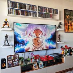 a large television mounted to the side of a wall above a shelf filled with books