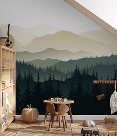 a room with mountains and trees painted on the wall